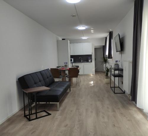 a living room with a couch and a table at 2 Zimmerwohnung in Bietingen in Gottmadingen