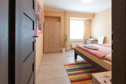 a small bedroom with a bed and a window at Cozy room at metro station, private bathroom, 9minutes oldtown, 15minutes airport, WiFi in Prague
