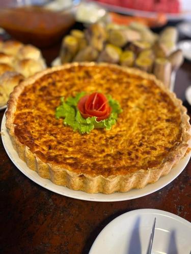 a pie sitting on a plate on a table at Pousada da praça in Morro de São Paulo