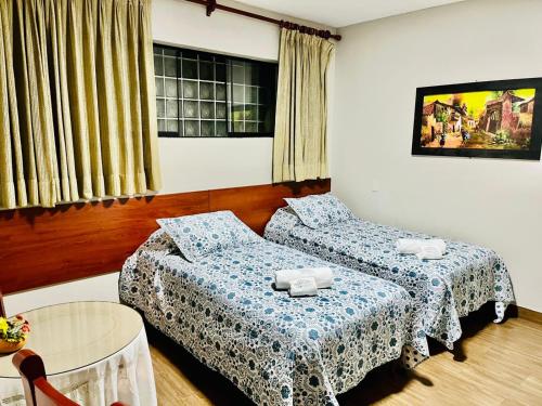 Кровать или кровати в номере Imperial Inn Hospedaje Turistico