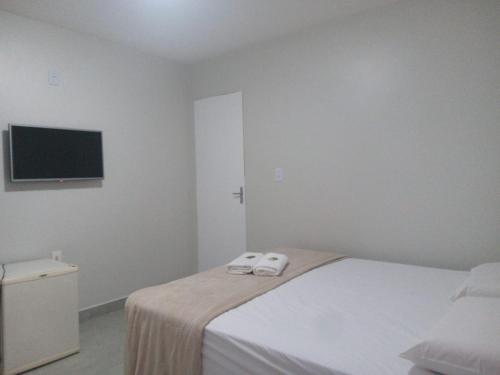 Katil atau katil-katil dalam bilik di Hotel Solar Vitória