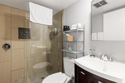 a bathroom with a toilet and a sink and a shower at Nightlife & Shop Old Town Scottsdale - Studio Unit in Scottsdale