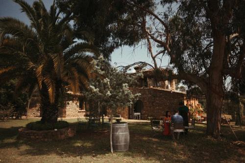 a group of people standing in front of a brick building at Mas Valoria in Peratallada
