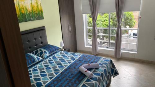 Ένα ή περισσότερα κρεβάτια σε δωμάτιο στο Amoblado laureles San Joaquín