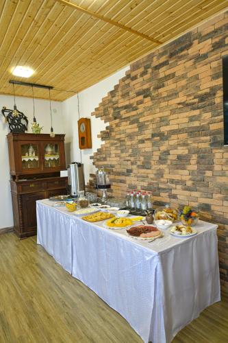 a table with plates of food on top of it at Madin Eco Hotel in Debed