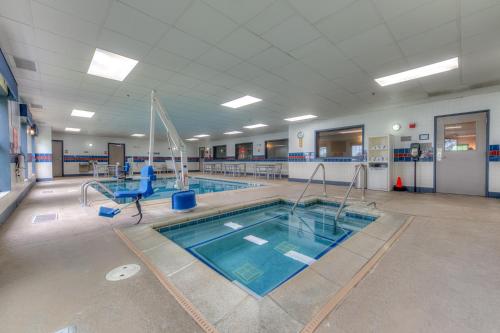 a large swimming pool in a building with a swimming pool at Country Inn & Suites by Radisson, Crystal Lake, IL in Crystal Lake