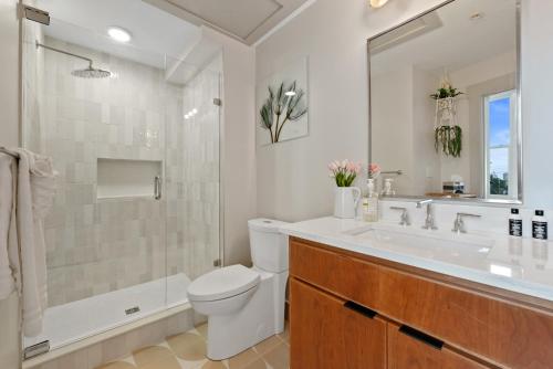 a bathroom with a sink and a toilet and a shower at The Roxanne 1 - Chic One Bedroom Townhome in OTR in Cincinnati