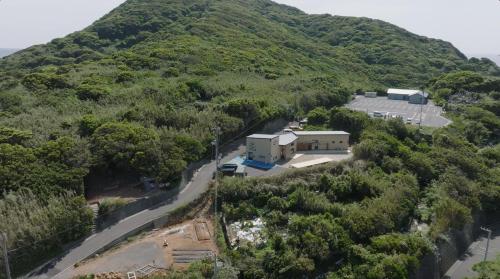 an aerial view of a house on a mountain at 柏島ヴィレッジ in Otsuki