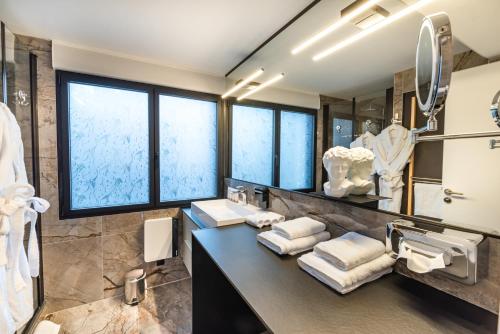 a bathroom with a sink and a mirror at MOYÏ in Basse-Goulaine