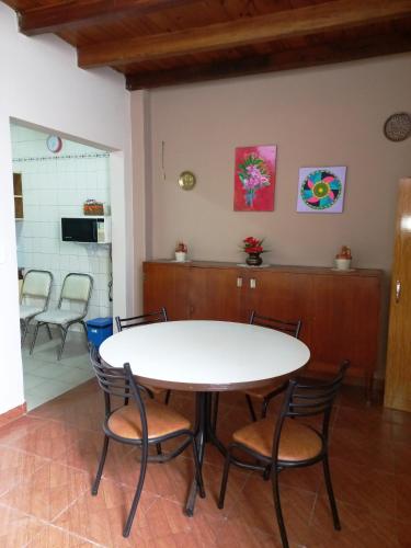 a dining room with a table and chairs at SUMAQ WASICHA SALTA in Salta