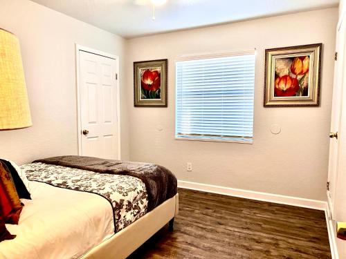 a bedroom with a bed and a window at Luxurious Bungalow in Payson in Payson