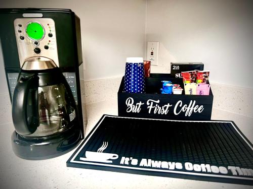 a coffee maker sitting next to a box of food at Luxurious Bungalow in Payson in Payson