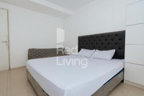 Postelja oz. postelje v sobi nastanitve RedLiving Apartemen Bassura City - Aokla Property Tower Dahlia