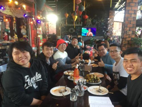 a group of people sitting at a table in a restaurant at Redhouse Dalat Hotel in Da Lat