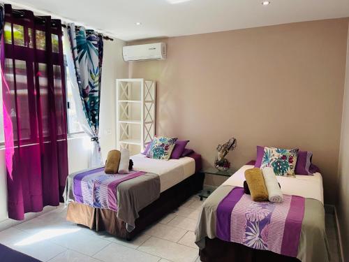 Voodi või voodid majutusasutuse Tahiti beach house toas