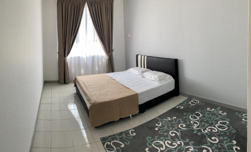 En eller flere senge i et værelse på The Caśa Homestay