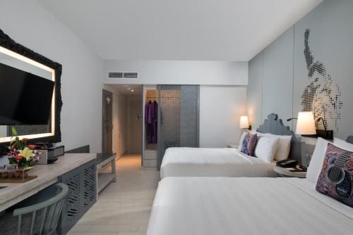 Postel nebo postele na pokoji v ubytování Hard Rock Hotel Bali