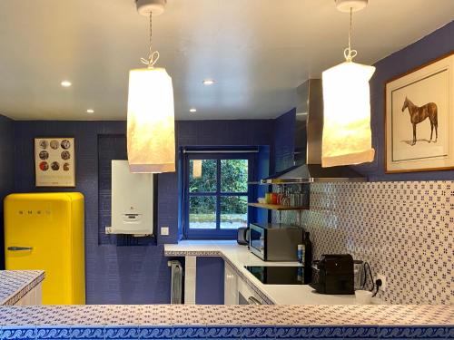 A kitchen or kitchenette at Le Gîte