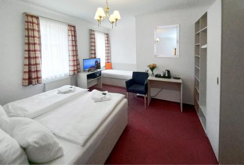 Ein Bett oder Betten in einem Zimmer der Unterkunft Hotel Hradec