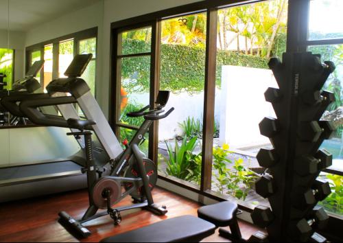 a room with a gym with a treadmill at The Amala Boutique Retreat in Seminyak