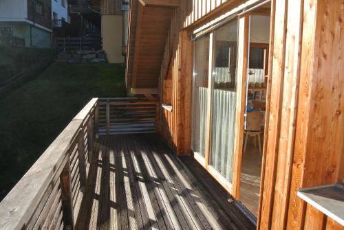 a porch of a house with a sliding glass door at Appartement Luisa in Bad Kleinkirchheim