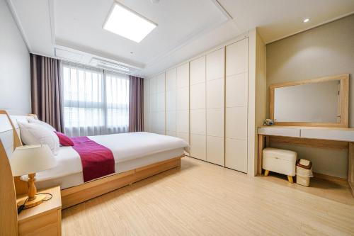 Postel nebo postele na pokoji v ubytování EdenStay