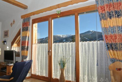 a room with a window with a view of mountains at Appartement Luisa in Bad Kleinkirchheim
