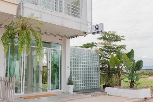 a building with a sign on the side of it at PB Place @ Kwan Payao in Phayao