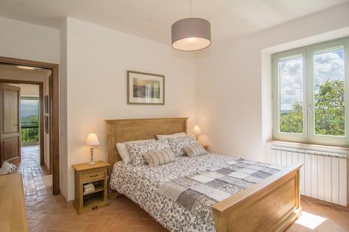 Ένα ή περισσότερα κρεβάτια σε δωμάτιο στο Casale Amerina