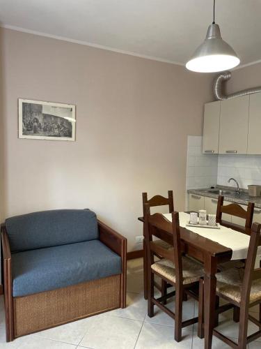 a kitchen with a table and a chair and a table and a dining room at Casa Vacanze La Villetta in Montefranco