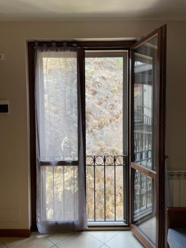 an open window with a view of a balcony at Casa Vacanze La Villetta in Montefranco