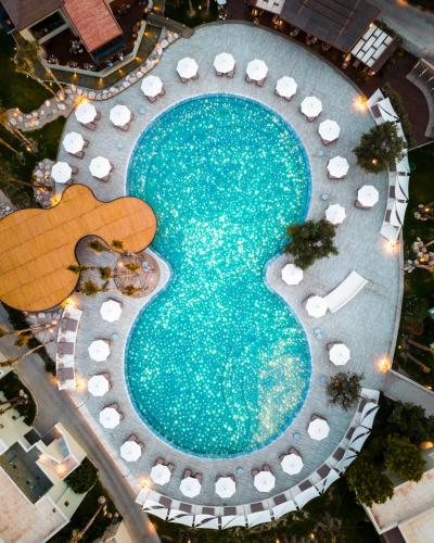 an overhead view of a swimming pool at a resort at Port Royal Villas and Spa - Adults Only in Kolimbia