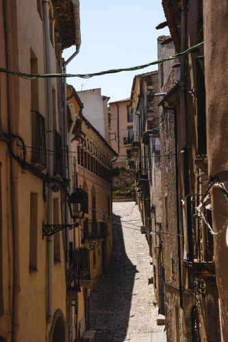 an alley with buildings and an alley way between two buildings at ORA Hotel Priorat, a Member of Design Hotels in Torroja