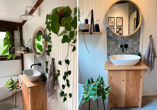 a bathroom with two sinks and a mirror at Forestchild Self Catering, The Crags in The Crags