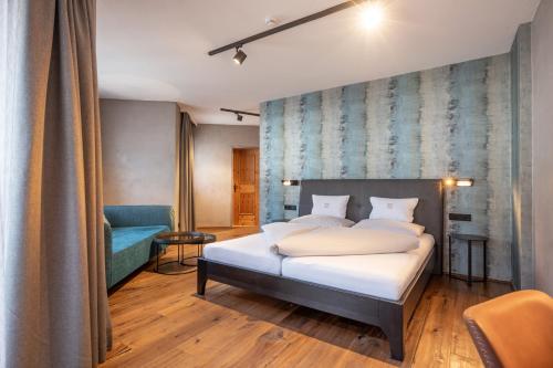 Cama o camas de una habitación en Familienparadies Sporthotel Achensee - FAMILIES ONLY