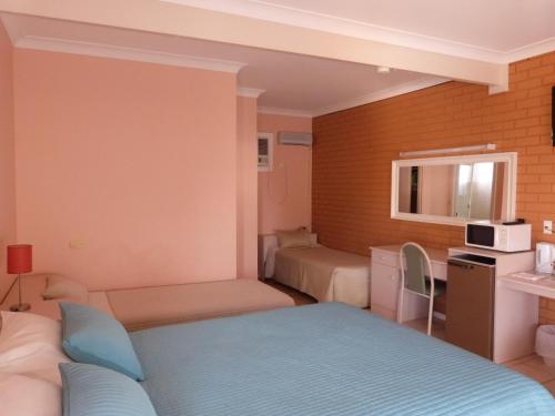 Postel nebo postele na pokoji v ubytování Fullarton Motor Lodge