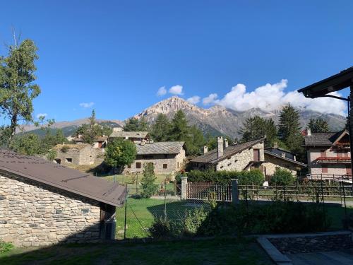 a view of a village with mountains in the background at Chalet Del Sole in Monfol