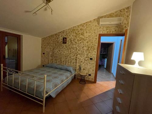 Un pat sau paturi într-o cameră la La casa del Pino