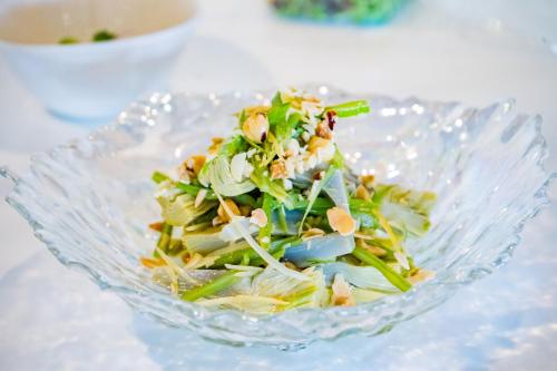 a salad in a glass bowl on a table at Moon Hotel & SPA. in Aguadulce