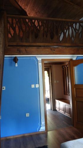 a room with a large blue door in a room at Недкова къща in Koprivshtitsa