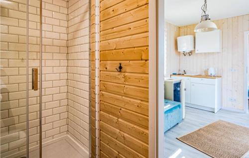 a shower with a glass door in a bathroom at Gorgeous Home In Rydzewo With House Sea View in Rydzewo