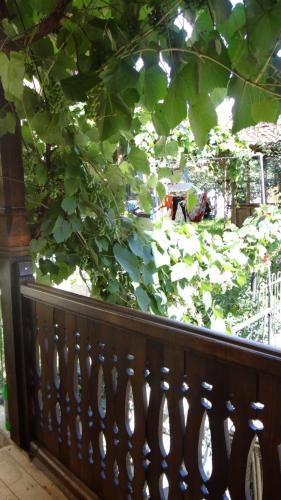 a wooden fence in front of a garden at Недкова къща in Koprivshtitsa