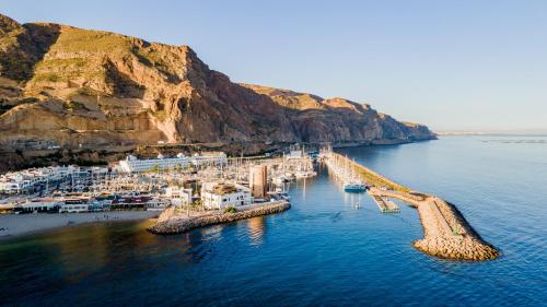 an aerial view of a dock in the water at Moon Hotel & SPA. in Aguadulce