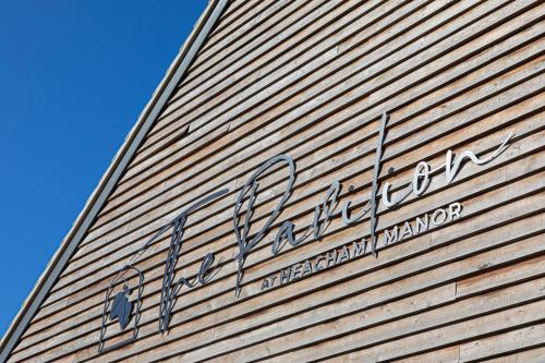 a sign on the side of a building at Heacham Manor Hotel in Hunstanton