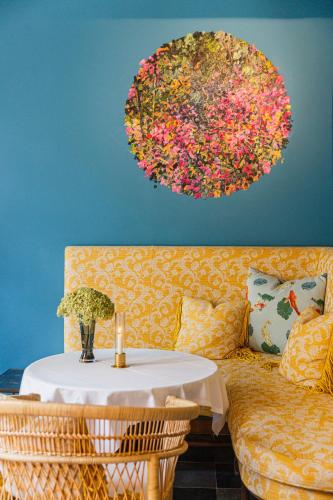 a living room with a table and a couch at Flora in Antwerp