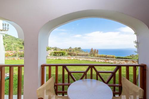 a view of the ocean from the balcony of a house at Sea View Village in Vasilikos