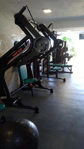 a gym with several chairs in a room at Hotel Pousada Casacolina in Búzios