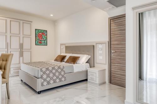 Posteľ alebo postele v izbe v ubytovaní Vomero High Hotel