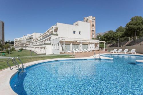 a large swimming pool in front of a building at Ona Benidorm Poniente in Benidorm
