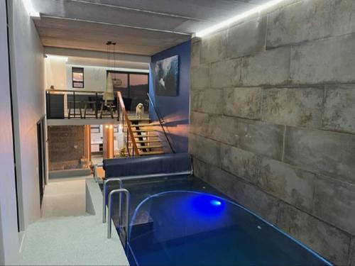 a living room with a tub in the middle of a room at Escape to Pringle in Pringle Bay
